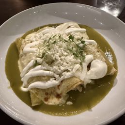 La Calle signature dishes Empanadas del DiaEnchiladas de MolePescado Frito Tacos